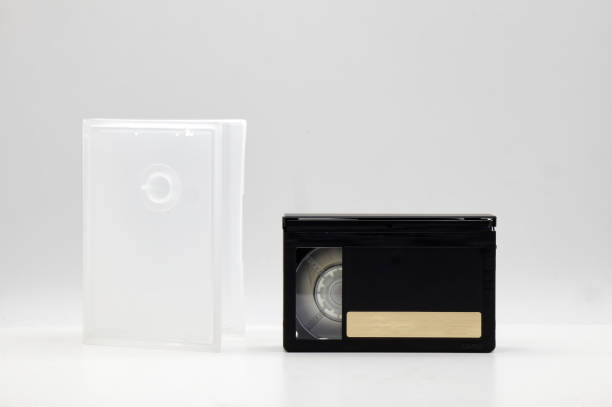 istock Vintage Mini DV video tape cassette with cassette box on white background. Retro style technology from the 90s 1371885328