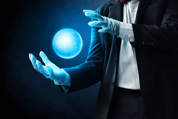 Priest is showing a luminous magic sphere in triangle shape in his hand in the dark. / You can see the animation movie of this image from my iStock video portfolio. Video number: 2192997747