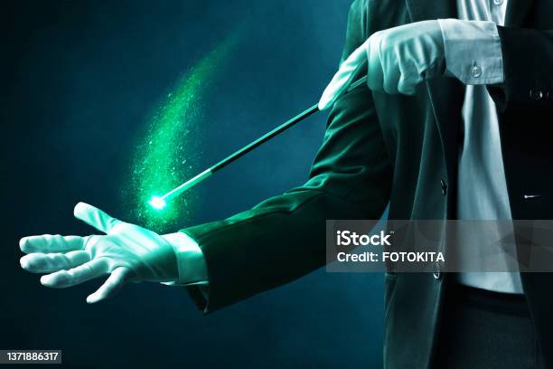 Magician Hand Showing Magic Trick Stock Photo - Download Image Now - Magician, Hand, Glittering
