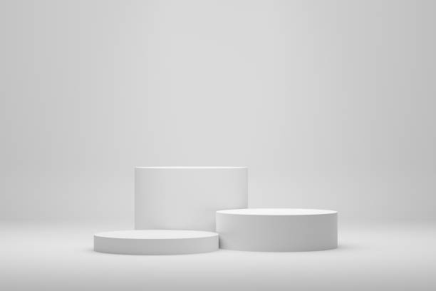 istock Blank white podium platforms or pedestals with white background for product display. Empty stands for showing or presenting products. 1371889926