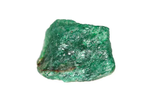 Closeup natural rough green Aventurine gemstone with an optical reflectance effect (aventurescence) on white background (shallow dof)