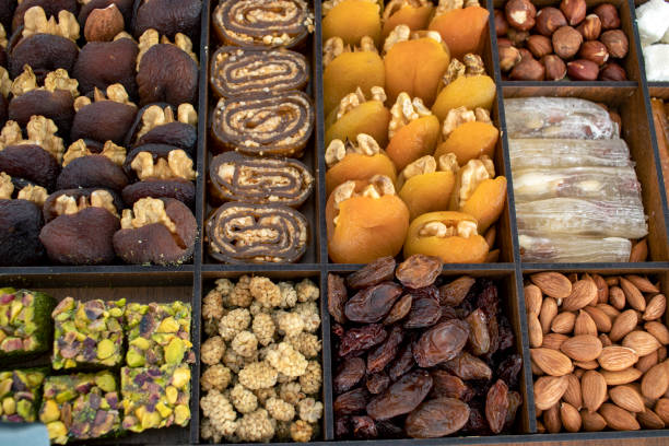 istock various nuts, candies and Turkish delight, stacked in the box. 1371893229