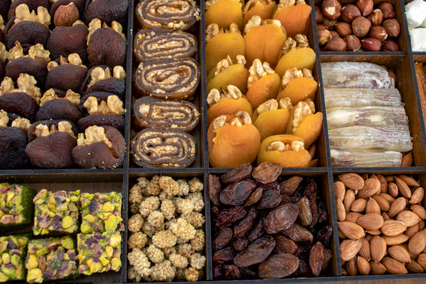 istock various nuts, candies and Turkish delight, stacked in the box. 1371893270