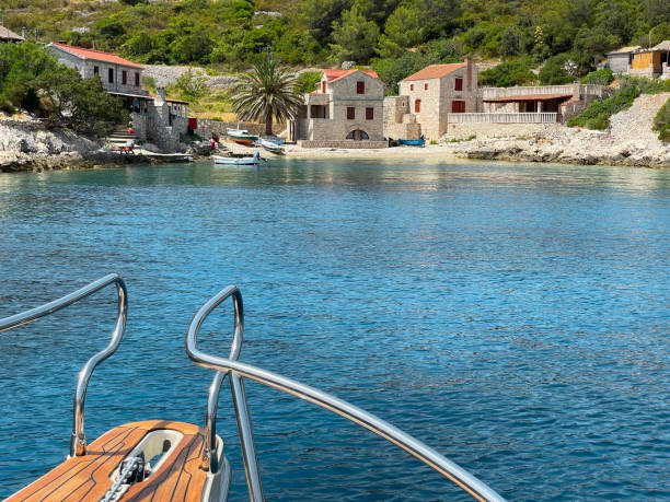 View of old town in front of Adriatic sea and boats moored, Dalmatia Region, Croatia, Europe.