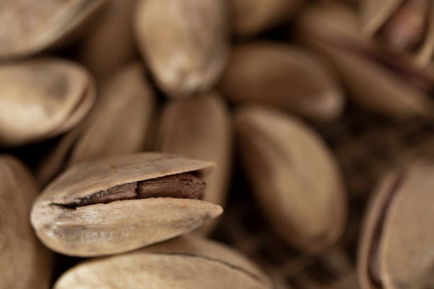 istock shelled pine nuts on a straw mat. close-up. 1371896331