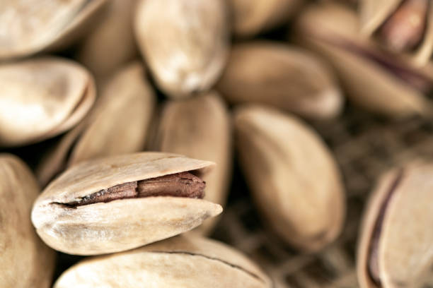 istock shelled pine nuts on a straw mat. close-up. 1371896352