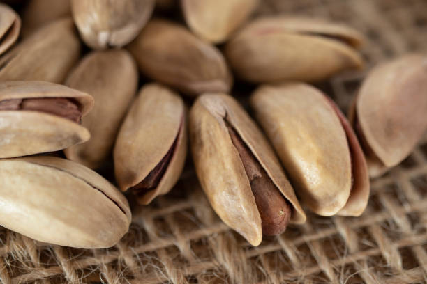 istock shelled pine nuts on a straw mat. close-up. 1371896359