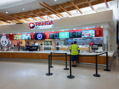 Orlando, Florida - February 9, 2022: Closeup View of Panda Express Restaurant inside Terminal B of Orlando International Airport (MCO).