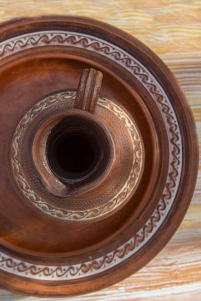 beautiful earthenware with oriental ornaments - plates and a jug.