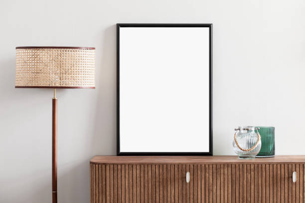 istock Artwork mock-up in interior design. Blank white vertical picture frame on a cupboard 1371902984