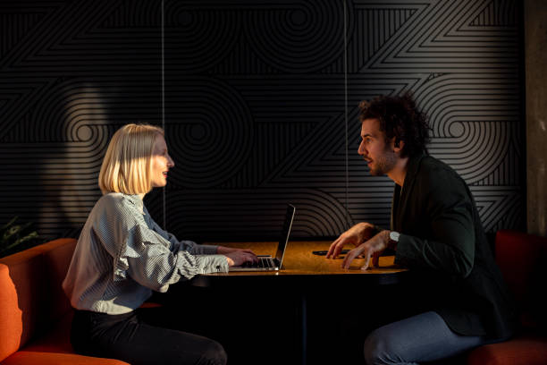 istock Two young attractive startup employees brainstorming 1371903219