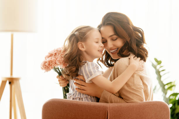 istock daughter congratulating mother 1371903220