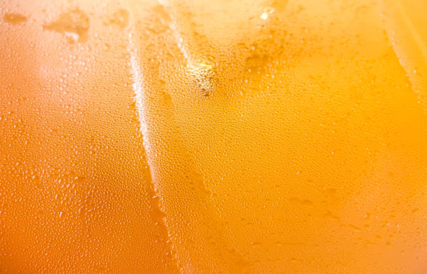 istock Glass with cold drink beer with condensation ice cool beverage background 1371904496
