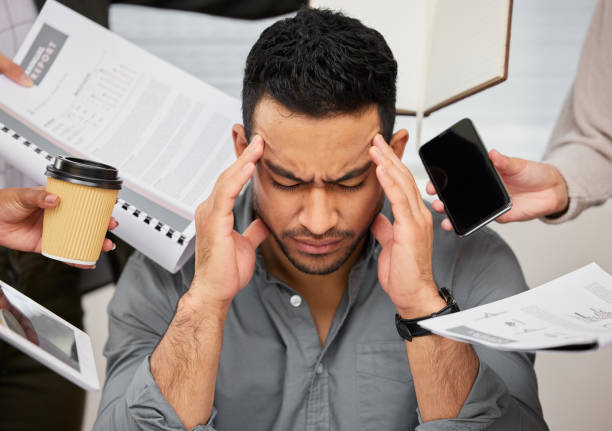 istock Shot of a young businessman looking overwhelmed 1371908180