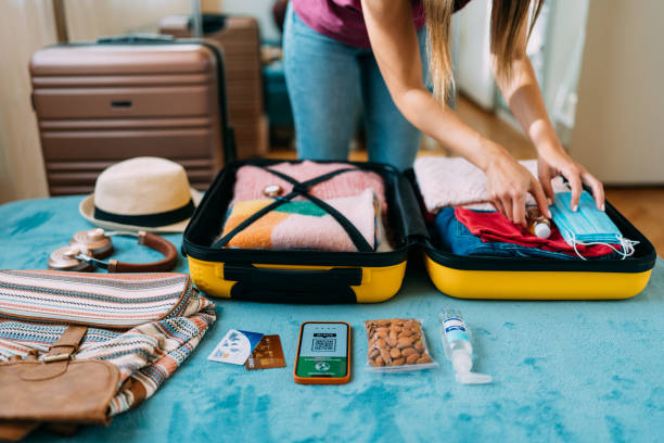 istock Woman packing suitcase for travel 1371909140