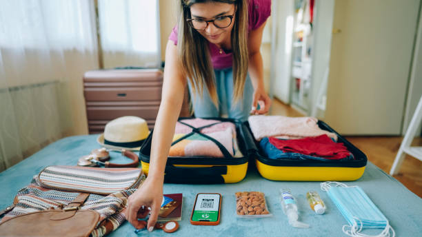 istock Woman packing suitcase for travel 1371909274