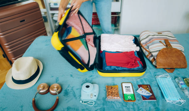 istock Woman packing suitcase for travel 1371909325
