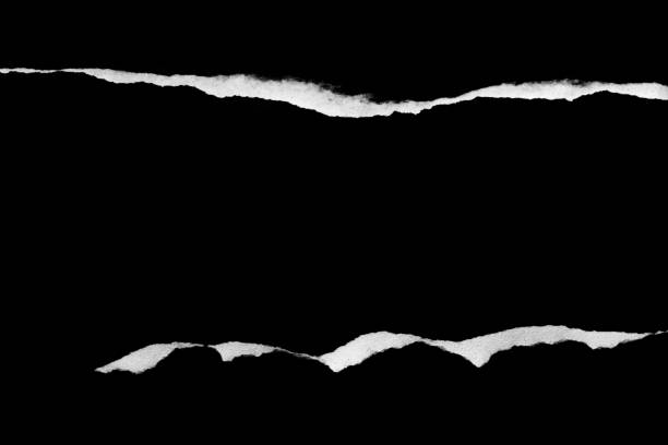 istock Ripped, torn paper edge isolated white on black, paper tear with space for copy 1371909612