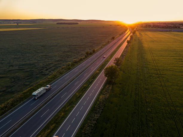 istock Cars on the road at sunset 1371911018