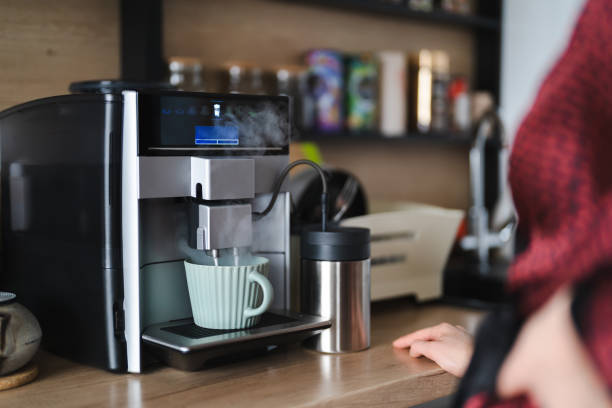 istock Woman use coffee machine to make coffee 1371912064