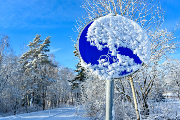 traffic sign for walking and bicycle path coverde in snow Hallabrottet Kumal Sweden february 19 2022
