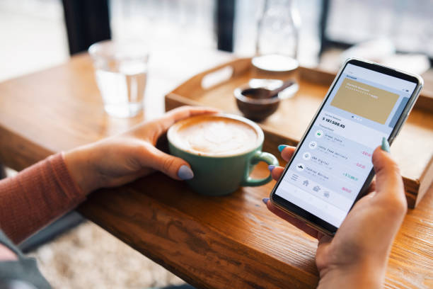 istock Managing online banking on cafe. 1371913209