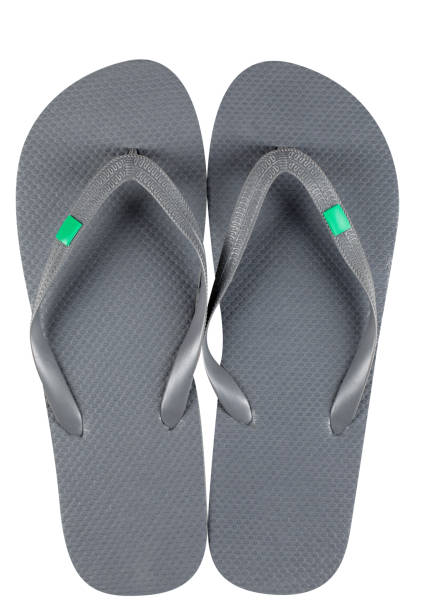Pair of black plastic flip-flops isolated on white background, clipping path, studio shot