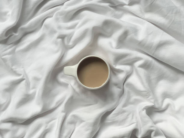 istock Cup of coffee on a white textile background 1371915132