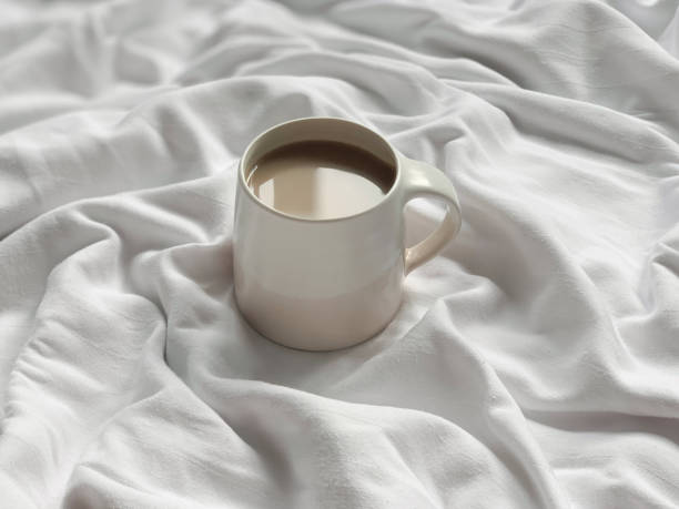 istock Cup of coffee on a white textile background 1371915146