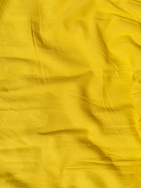 istock Yellow linen cloth texture pattern for abstract design Wavy natural textile backdrop Sunny color fabric blank background 1371917444