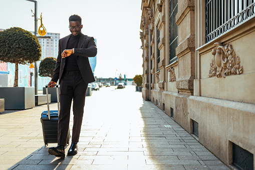 Businessman checking the time on his wrist watch