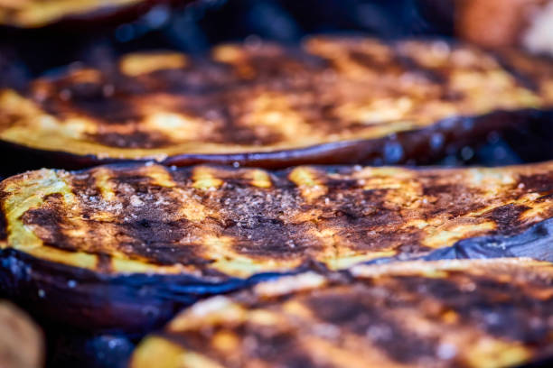 istock close up with eggplant slices on the grill. 1371918566