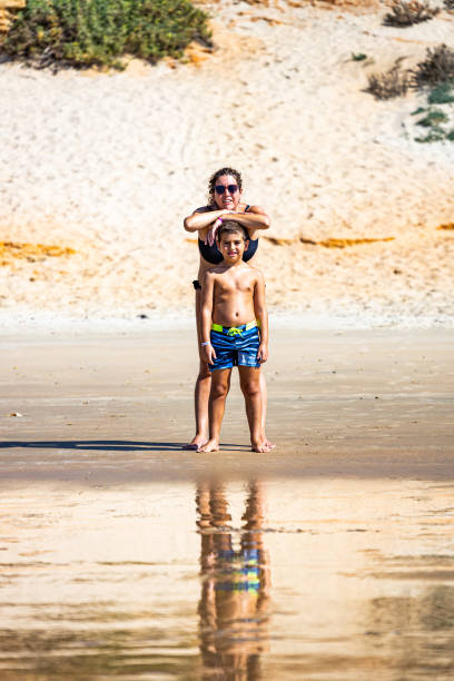 istock Mother and son on a beach 1371919052