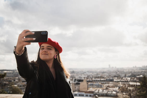 istock Young woman taking a selfie in Paris 1371919215