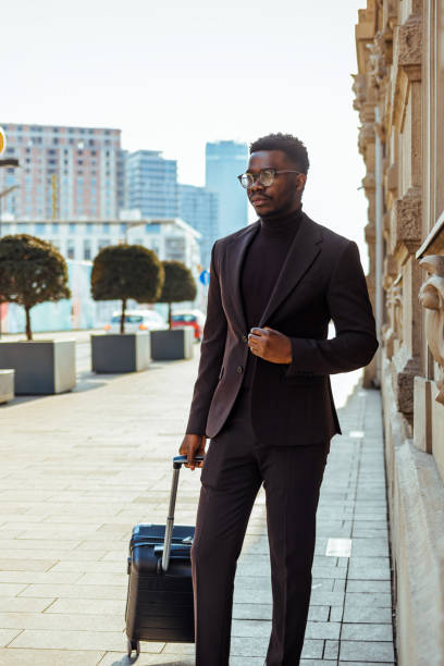 istock Tourist man holding suitcase luggage 1371920381