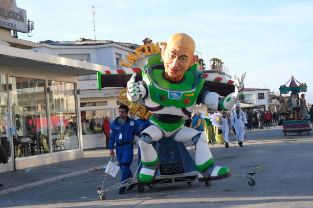 Zagreb,Croatia - March 26, 2016 : People visiting exhibition by Danilo Baletic named Transformers protecting Zagreb on square Franje Tudjmana in Zagreb, Croatia. Exhibition of several giant sized scrap metal sculptures inspired by Transformers robots is made of automobile parts and waste. 