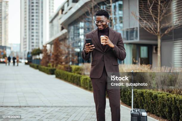 Smiling Businessman With Smart Phone And Cup Stock Photo - Download Image Now - Businessman, Business Travel, Men