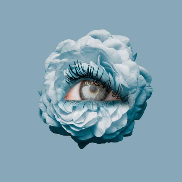 istock Blue rose flower with an eye inside it on navy background. Modern design. Contemporary art. Creative conceptual and colorful collage. Beauty, art, vision 1371922499