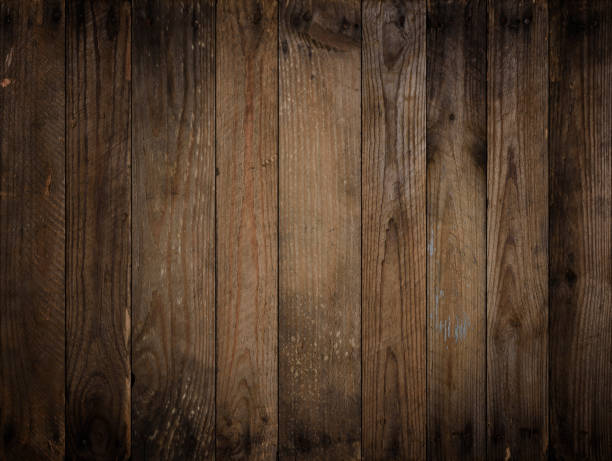 istock Dark wooden background. Weathered vignetted rustic wood texture 1371922590