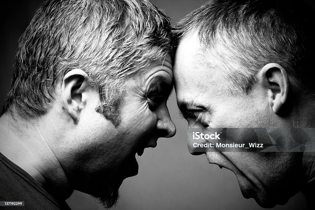 Dos hombres en confrontación - Foto de stock de Cara a cara libre de derechos