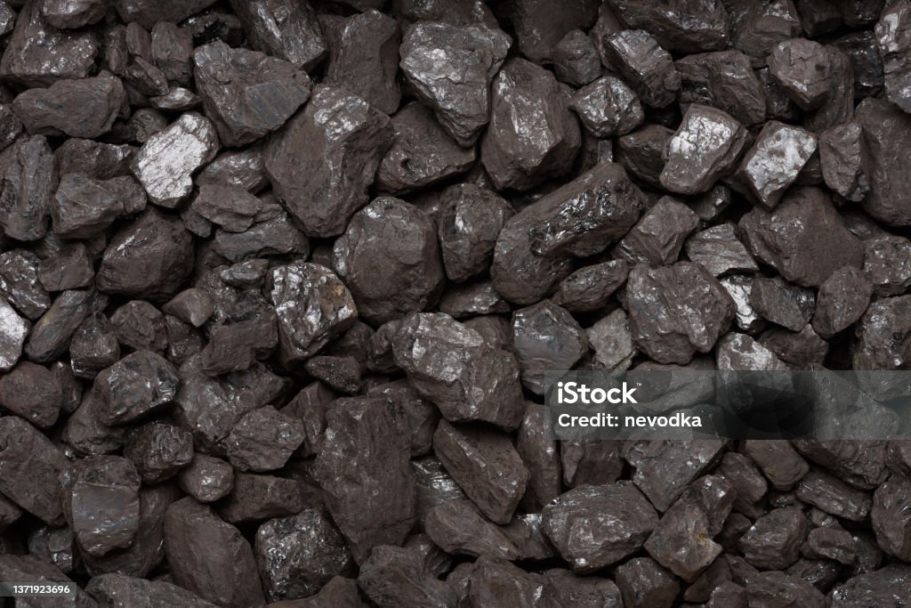 Natural black stone coal background top view Natural black stone coal background top view. Fossil fuel coal lumps texture. Lignite Stock Photo