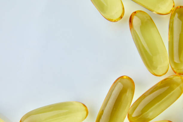 istock Flat lay fish oil capsules Omega 3 isolated on white background 1371925039