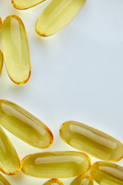 istock Flat lay fish oil capsules Omega 3 isolated on white background 1371925049