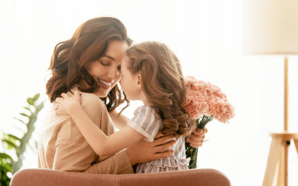 istock daughter congratulating mother 1371926330