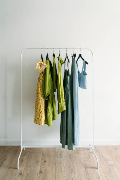 Capsule of colorful summer clothes on a rail. stock photo