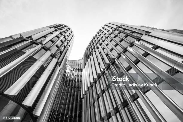 Black And White Highrise Building Of A Metropolis Center From Below Stock Photo - Download Image Now