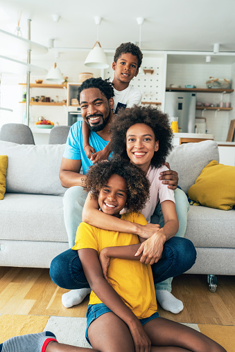 Portrait of african ethnicity family, happy together at home