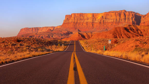Sunrise over Mountains and a Street at Marble Canyon in Arizona Beautiful road to Marble Canyon. The Marble Canyon is the section of the Colorado River canyon in northern Arizona from Lee's Ferry to the confluence with the Little Colorado River, which marks the beginning of the Grand Canyon. grand canyon stock pictures, royalty-free photos & images