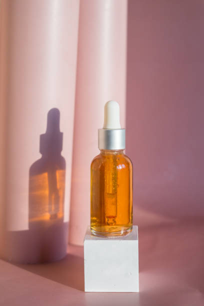 istock Composition with natural cosmetic oil and pomegranate on light background 1371928657