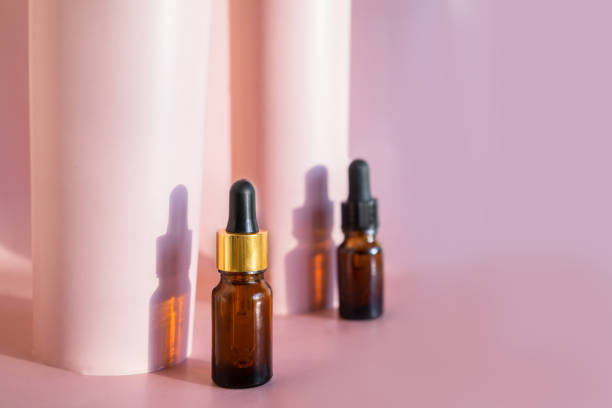 istock Composition with natural cosmetic oil and pomegranate on light background 1371928658